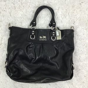 Coach black pebble grain leather purse.